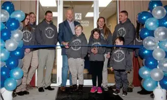  ?? PHOTO PROVIDED ?? Mayor Mark Senter cuts the ribbon at the opening ceremony of Dustin’s Place.