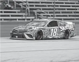  ?? RODRIGUEZ/AP
RICHARD W. ?? Kyle Busch drives on the front stretch during a NASCAR Cup Series race at Texas Motor Speedway on Wednesday. Busch emerged to win the race, originally scheduled for Sunday and postponed three times by weather.