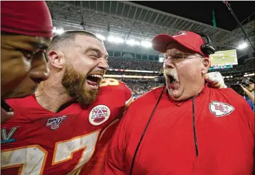  ?? DAVID J. PHILLIP / AP ?? Travis Kelce (left) celebrates with Andy Reid after defeating the San Francisco 49ers. Big Red finally got his Super Bowl title thanks to Patrick Mahomes leading the resilient Chiefs to another comeback win.