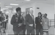  ??  ?? Congressma­n Steny Hoyer speaks with his Thomas Stone High School Junior ROTC escorts Alzandra Williams Jr. and Igura Rehman and Principal Chrystal Benson, right.