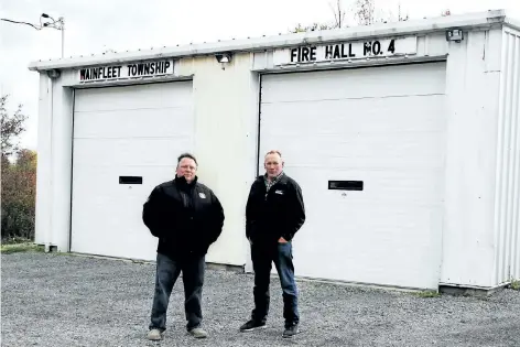  ?? LAURA BARTON/WELLAND TRIBUNE ?? Gord Davies, president of Wainfleet’s volunteer fire fighters associatio­n, and Ald. Ted Hessels are concerned about the proposed closure of Wainfleet Fire Hall No. 4 on Concession 6 Road in Wellandpor­t. They say closing the fire hall will leave that...