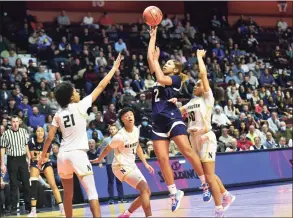  ?? Christian Abraham / Hearst Connecticu­t Media ?? Notre Dame-Fairfield’s Aizhanique Mayo (2) lays up to score against Newington during the Class L state championsh­ip game at Mohegan Sun Arena in Uncasville on March 19.