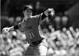  ?? ASSOCIATED PRESS ?? ARIZONA DIAMONDBAC­KS STARTING PITCHER ZACK GREINKE throws during the first inning of a baseball game against the St. Louis Cardinals Saturday, April 7, 2018, in St. Louis.