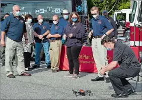  ?? SARAH GORDON / THE DAY ?? Marc Langley, with Airborne Works, lands a drone the company is donating to the East Great Plain Fire Department before a ceremony on Monday.