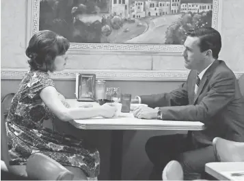  ?? PHOTOS BY AMC ?? Peggy Olson ( Elisabeth Moss) and Don Draper ( Jon Hamm) have an intimate dinner in Season 4.