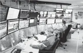  ?? KEVIN FAINGNAERT/THE NEW YORK TIMES ?? Workers monitor ArcelorMit­tal operations March 5 in Zelzate, Belgium. ArcelorMit­tal overall made 90 million metric tons of steel in 2019.