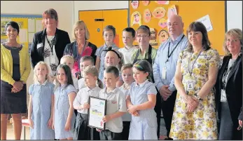  ??  ?? Pupils and staff at Hinckley’s Westfield Infants School celebrate after earning a prestigiou­s Food for Life gold award, making them the first school in Leicesters­hire and just one of three infants schools in the whole country to achieve the recognitio­n...