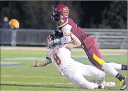  ?? JEFF KRAGE/DAILY SOUTHTOWN ?? Brother Rice defensive back Danny Fitzgerald (8) is grabbed by Montini wide receiver Matt Ross on a pass on Friday. Brother Rice’s defense held Montini to 3 yards passing.