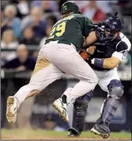  ?? AP file photo/KEVIN P. CASEY ?? Plays like this could be a thing of the past in major-league baseball after the rules committee announced a ban on home-plate collisions starting no later than 2015.