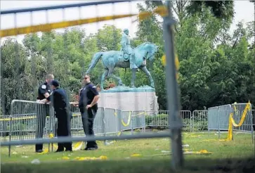  ?? Chip Somodevill­a Getty Images ?? A STATUE OF ROBERT E. LEE was the focal point of a violent confrontat­ion in Charlottes­ville, Va.