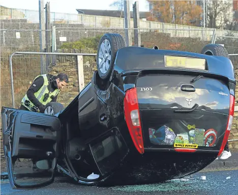  ??  ?? THERE were traffic delays on a busy Dundee today road after a car flipped on to its roof.
The accident happened just before 9am on Broughty Ferry Road, near to Lilybank Road.
It is understood that no injuries were reported.
The vehicle’s windows were