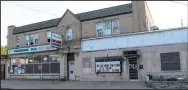  ?? (AP/The Vindicator/Ed Runyan) ?? The Torch Club Bar & Grille in Youngstown, Ohio, is shown Sunday after the early-morning shooting.