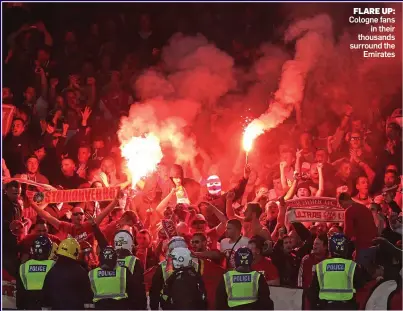  ??  ?? FLARE UP: Cologne fans in their thousands surround the Emirates