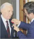  ??  ?? Normandy veteran Irvine Rae receives the honour