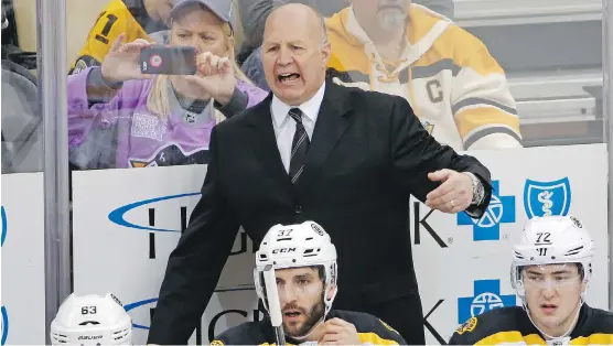  ?? AP FILES ?? Claude Julien behind the bench in one of his last games as coach of the Bruins. Julien, Pat Burns and Alain Vigneault all graduated from the Hull Olympiques to coach in the NHL.