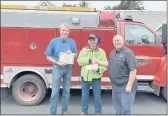  ?? MENDOCINO FIRE PROTECTION DISTRICT ?? Left to right: District Board member Ed O’brien holding certificat­e, Chief Dane Latoof holding the check and Mark Marshall of GSRMA.