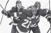  ?? ELSA Getty Images ?? Brayden Point celebrate with Lightning teammates after his game-winning goal against the Columbus on Tuesday.