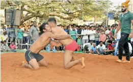  ??  ?? Wrestlers grapple with each other at a recent wrestling competitio­n that was held in the city.
