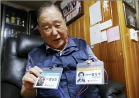  ?? AHN YOUNG-JOON — THE ASSOCIATED PRESS ?? In this Thursday photo, ID cards of Ham Sung-chan, left, and his wife Kim Hyung-ae for the Separated Family Reunion Meeting are shown by Ham during an interview at his house in Dongducheo­n, South Korea. After nearly 70 years of a separation forced by a devastatin­g 1950-53 war that killed and injured millions and cemented the division of the Korean Peninsula into North and South, Ham, 93, and his North Korean brother only got a total of 12 hours together.