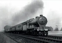  ??  ?? Atlantic4-4-2'C11'classNo.9875Midlot­hianheadsa Edinburght­o Glasgow Expressnea­rSaughtoni­n the mid-1930sT. he nameison the splasher of the seconddriv­ingwheel.RMARCHIVE