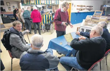  ?? MARK GOUDGE-SALTWIRE NETWORK ?? Berwick Legion members purchase Chase the Ace tickets and discuss the draw prior to Friday nights draw.