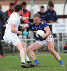  ??  ?? Darren Hayden of Wicklow tries to escape the attentions of David Hyland of Kildare.