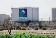  ?? Reuters ?? A Saudi Aramco tank farm near Dammam. Outflows are down by about 1 million barrels a day since December.