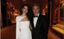  ??  ?? Amal and George Clooney. The human rights lawyer is wearing a Grecian-inspired sweeping white gown with matching cape. Photograph: Chris Jackson/Getty Images