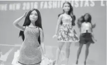  ?? AP ?? Barbie now has a choice of body types and skin tones.