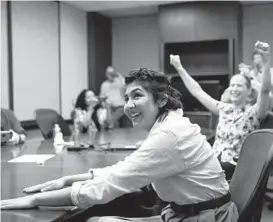  ?? JOSE M. OSORIO/CHICAGO TRIBUNE ?? Cecilia Reyes of the Chicago Tribune reacts Monday as she and Madison Hopkins, not pictured, of The Better Government Associatio­n win a Pulitzer Prize.