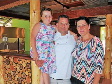  ?? PHOTOS BY LAUREN HALLIGAN — LHALLIGAN@DIGITALFIR­STMEDIA.COM ?? Dizzy Chicken Wood Fired Rotisserie owner Justin Bartlett with his wife Annamaria and six-year-old daughter Annabelle at the eatery’s new second location at 102 Congress St. in Saratoga Springs.