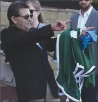  ?? (Arkansas Democrat-Gazette/Thomas Metthe) ?? Jim Barnes, assistant to Hall of Fame trainer Bob Baffert, points to jockey Martin Garcia after Charlatan won the first division of the Arkansas Derby on Saturday at Oaklawn in Hot Springs.