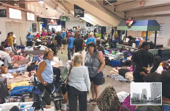  ?? NERVOUS: Evacuees hunker down at Germain Arena in Fort Myers, Florida ahead of Hurricane Irma’s arrival as ( inset) downtown Miami stands empty. Pictures: AFP ??