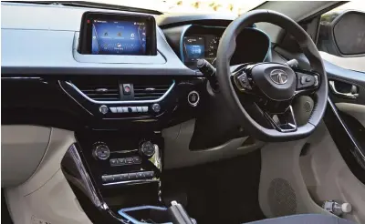  ??  ?? Dashboard gets electric blue highlights exclusive to the Nexon EV to complement the exterior. Steering wheel diameter has gone up in comparison with the pre-facelift ICE variants of the Nexon