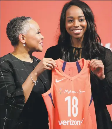  ?? Julie Jacobson / Associated Press ?? Connecticu­t Sun rookie Lexie Brown, right, with league president Lisa Borders on WNBA Draft night.