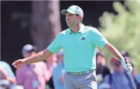  ?? TNS ?? Sergio Garcia reacts after hitting one of five straight shots into the water on the 15th hole during the first round of the Masters.