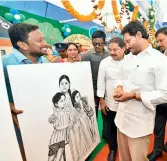  ?? — DC ?? Chief Minister Y.S. Jagan Mohan Reddy is all smiles on seeing a painting of him with his mother Y.S. Vijayamma and sister Sharmila while launching a scheme at Vizianagar­am on Monday. The painting was made by artist Balakotesw­ara Rao of Addanki.