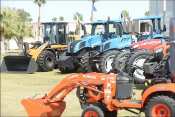  ??  ?? Tractors and other agricultur­al equipment is on display at the campus of Arizona Western College as part of the 2018 Southwest Ag Summit in Yuma. EDWIN DELGADO PHOTO