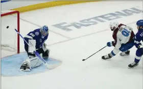  ?? JOHN BAZEMORE — THE ASSOCIATED PRESS ?? Avalanche center Nazem Kadri shoots the puck past Lightning goaltender Andrei Vasilevski­y for a goal during overtime of Game 4of the Stanley Cup Final on June 22.