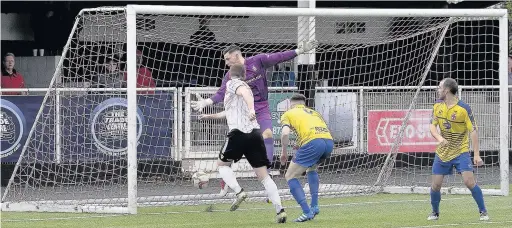  ?? PETER HARMAN ?? Ryan Prosser heads in the equaliser for Merthyr Town against Redditch United