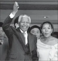  ?? WU ZHIYI / CHINA DAILY ?? Late South African president Nelson Mandela (left) waves to the audience before delivering a speech at Peking University in 1999 during his state visit to China.