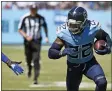  ?? MARK ZALESKI — THE ASSOCIATED PRESS ?? Tennessee Titans running back Derrick Henry (22) carries the ball against the Indianapol­is Colts in the first half of an NFL football game Sunday, Sept. 26, 2021, in Nashville, Tenn.