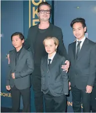  ??  ?? Brad Pitt with his children