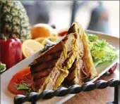  ?? Atria’s ?? A classic summer Cuban sandwich will be served with pineapple slaw at the National Aviary’s tropical-themed party on Feb. 22.