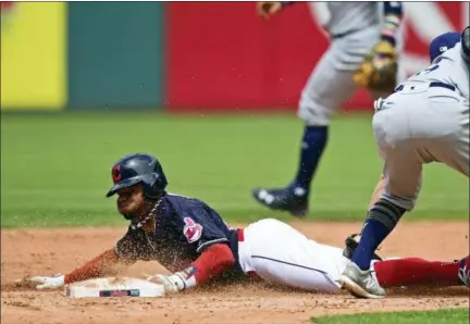  ?? DAVID DERMER — THE ASSOCIATED PRESS ?? The Indians’ Rajai Davis steals second base as the Brewers’ Eric Sogard is late on the tag in the fifth inning. Davis stole three bases.