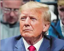  ?? AP FILE PHOTO ?? Former President Donald J. Trump watches the NCAA Wrestling Championsh­ips Saturday in Tulsa, Okla.