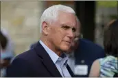  ?? CHARLIE NEIBERGALL — THE ASSOCIATED PRESS ?? Former Vice President Mike Pence talks with residents in Des Moines, Iowa, on May 23. Pence will return to the state Wednesday, he said, to launch his presidenti­al bid.