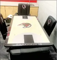  ??  ?? Tables and chairs in the arena facility are adorned with Blackhawks and team colors.