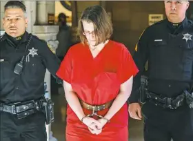  ??  ?? Laurel Schlemmer, accused of drowning two of her sons, is led to the courtroom Wednesday at the Allegheny County Courthouse.