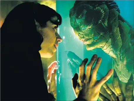  ?? Fox Searchligh­t Pictures ?? “THE SHAPE OF WATER” is a dreamlike, 1960s-set love story between a mute janitor (Sally Hawkins) and a fish-man (Doug Jones).